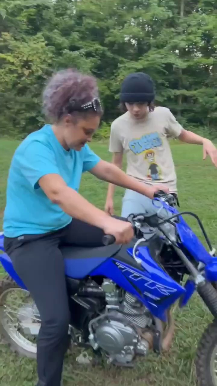 Mom tries out her son's bike